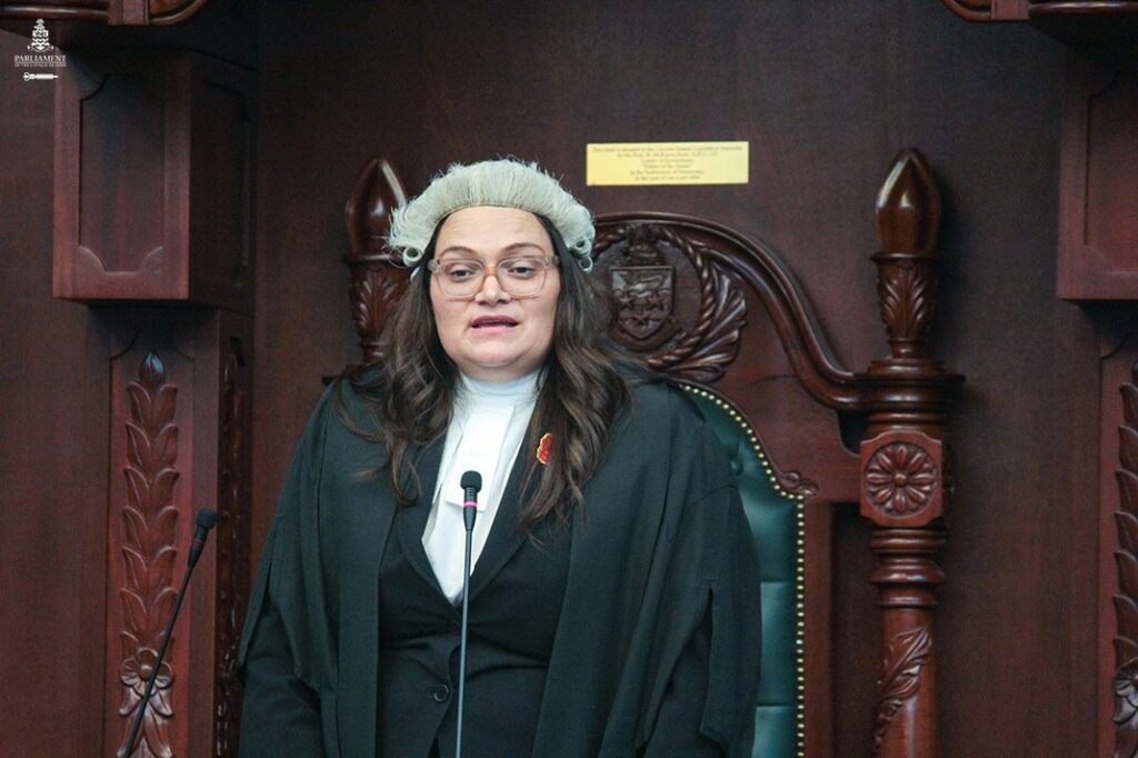 The former Speaker Katherine Ebanks-Wilks speaks to the House from the Speaker's Dais.